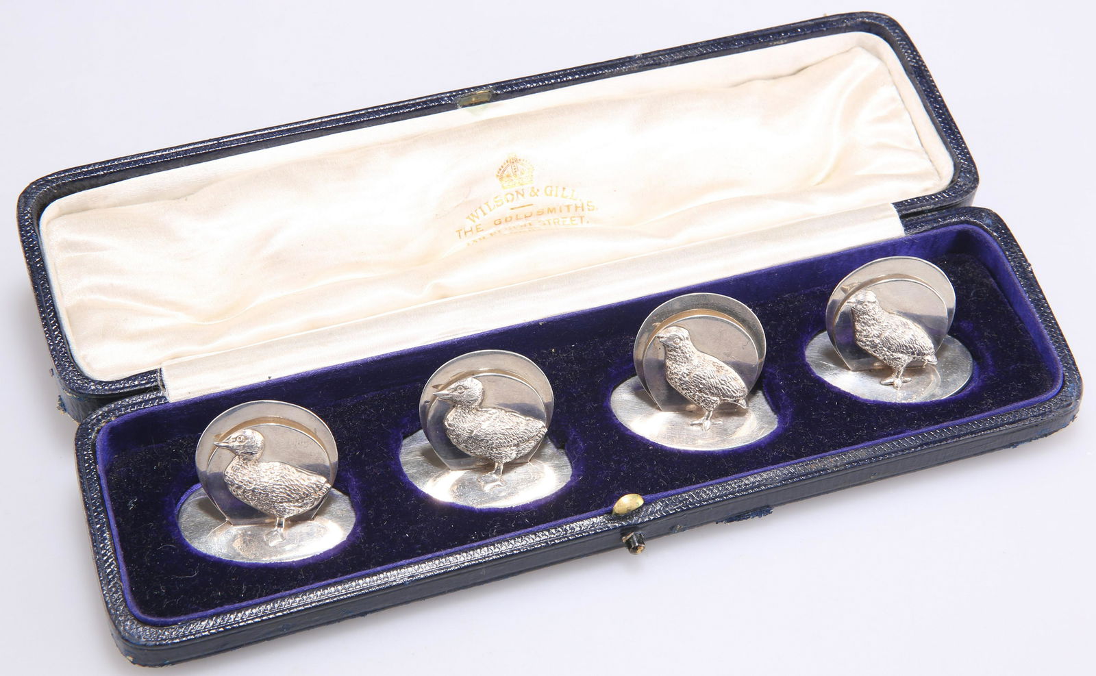 A SET OF FOUR GEORGE V SILVER MENU HOLDERS (1 of 2)