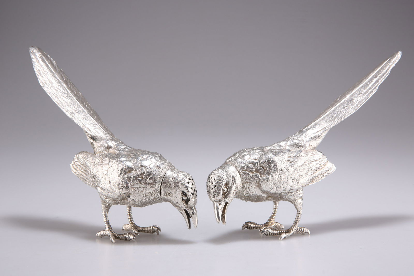 A PAIR OF ELIZABETH II SILVER NOVELTY BIRD PEPPERS (1 of 2)