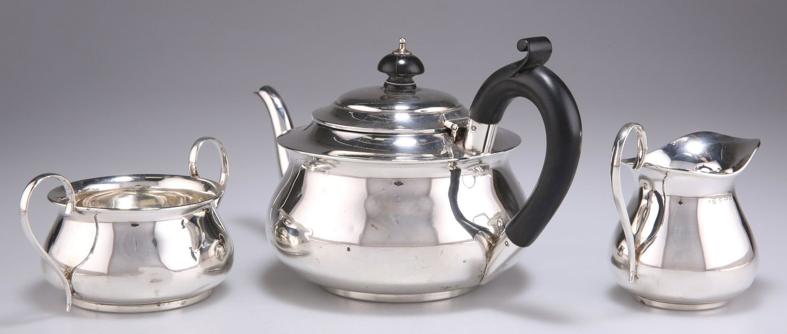 A GEORGE V SILVER THREE-PIECE TEA SERVICE (1 of 2)