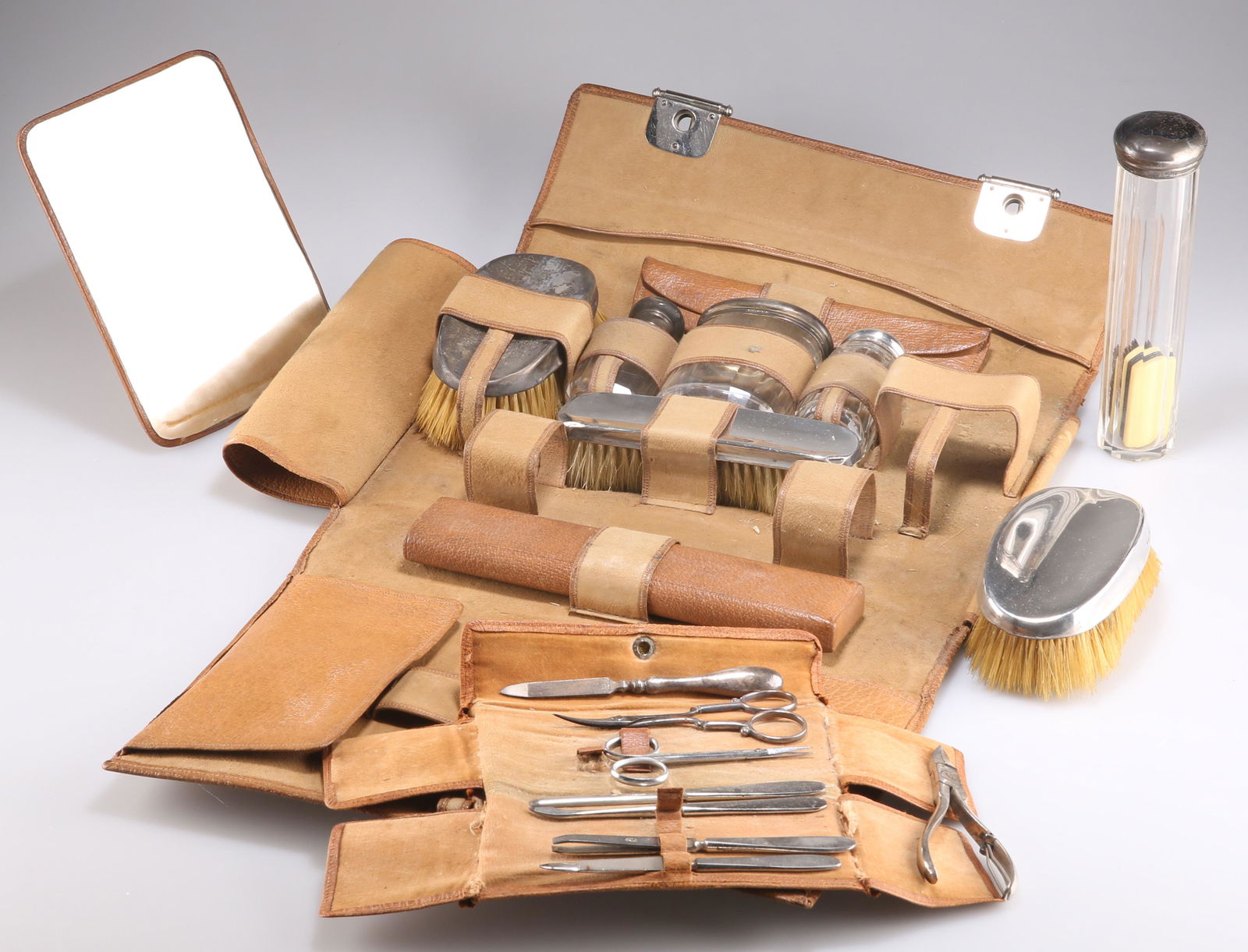AN EDWARDIAN GENTLEMAN'S SILVER-TOPPED DRESSING TABLE SET AND MANICURE SET (1 of 2)