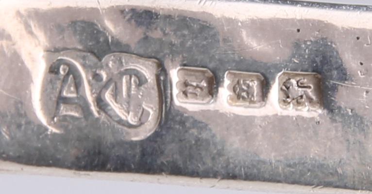 A PAIR OF ARTS AND CRAFTS SILVER SERVING SPOONS (1 of 1)