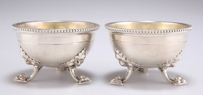 A GOOD PAIR OF VICTORIAN SILVER SALTS: A GOOD PAIR OF VICTORIAN SILVER SALTS, by John Samuel Hunt, London 1864, with beaded rims and leaf-capped downswept legs with trefoil feet, gilded interiors, signed 'HUNT & ROSKELL', each numbered 309