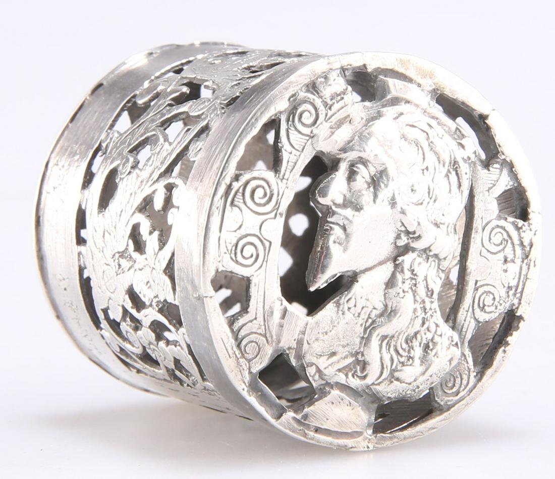 A CHARLES I SILVER COUNTER BOX: A CHARLES I SILVER COUNTER BOX, pierced and engraved with a bust of Charles I to the lid, and Henrietta Maria to the base in the manner of Simon and Willem de Passe, the sides pierced and engraved wit