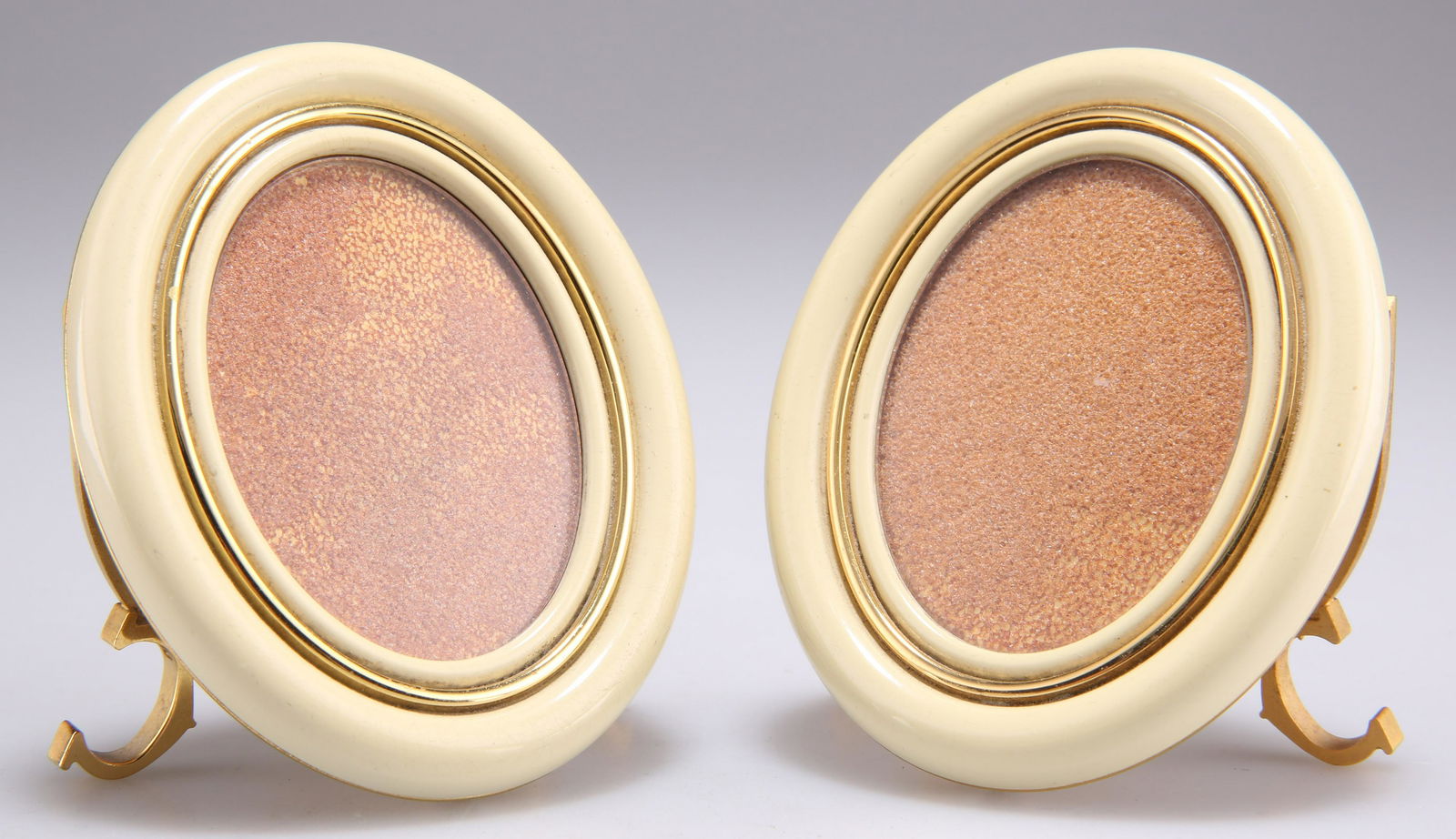 CARTIER: A PAIR OF GILT METAL AND ENAMEL PHOTOGRAPH FRAMES (1 of 1)