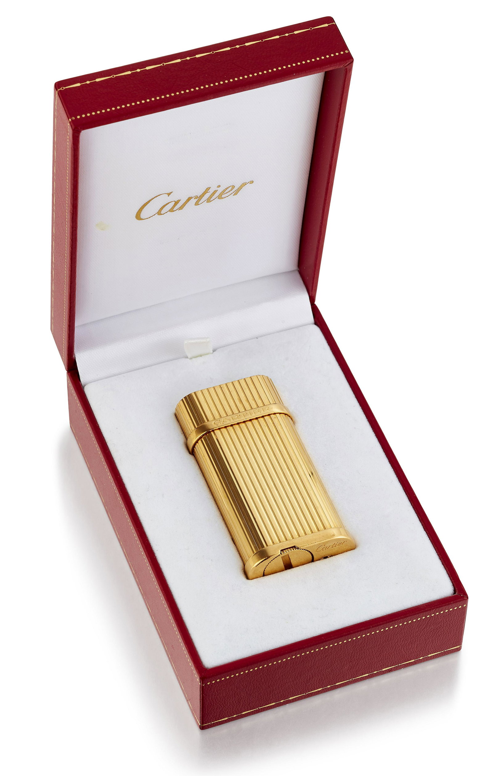 A CARTIER GOLD PLATED POCKET GAS LIGHTER: A CARTIER GOLD PLATED POCKET GAS LIGHTER, oblong form with fluted decoration and engraved 'Cartier' to the side. 149890, signed 'Cartier', boxed
