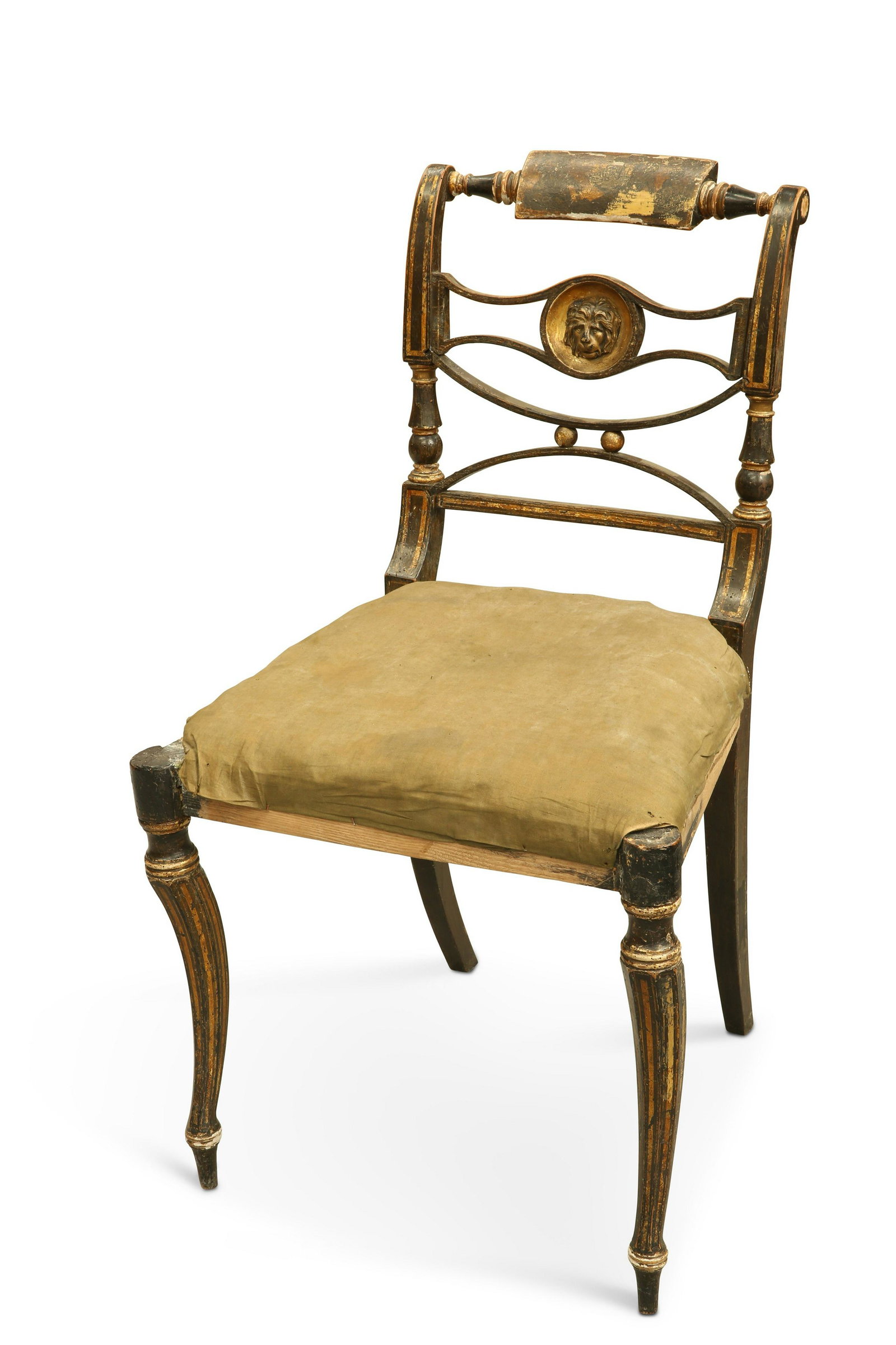 A REGENCY GILDED AND EBONISED SIDE CHAIR, IN THE MANNER OF THOMAS HOPE: A REGENCY GILDED AND EBONISED SIDE CHAIR, IN THE MANNER OF THOMAS HOPE A REGENCY GILDED AND EBONISED SIDE CHAIR, IN THE MANNER OF THOMAS HOPE, the back centred by a carved lion mask on a recessed roun