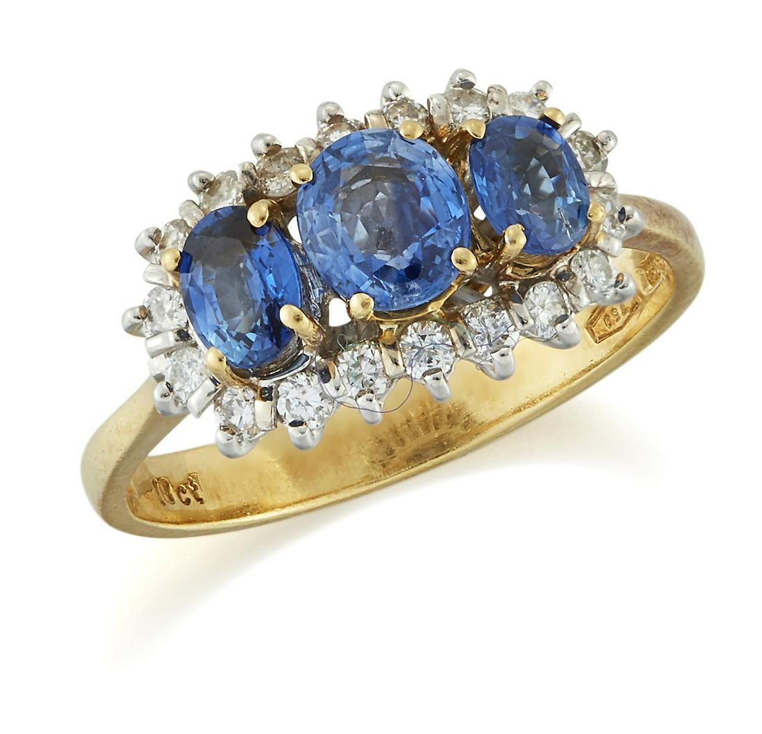AN 18 CARAT GOLD SAPPHIRE AND DIAMOND CLUSTER RING (1 of 1)