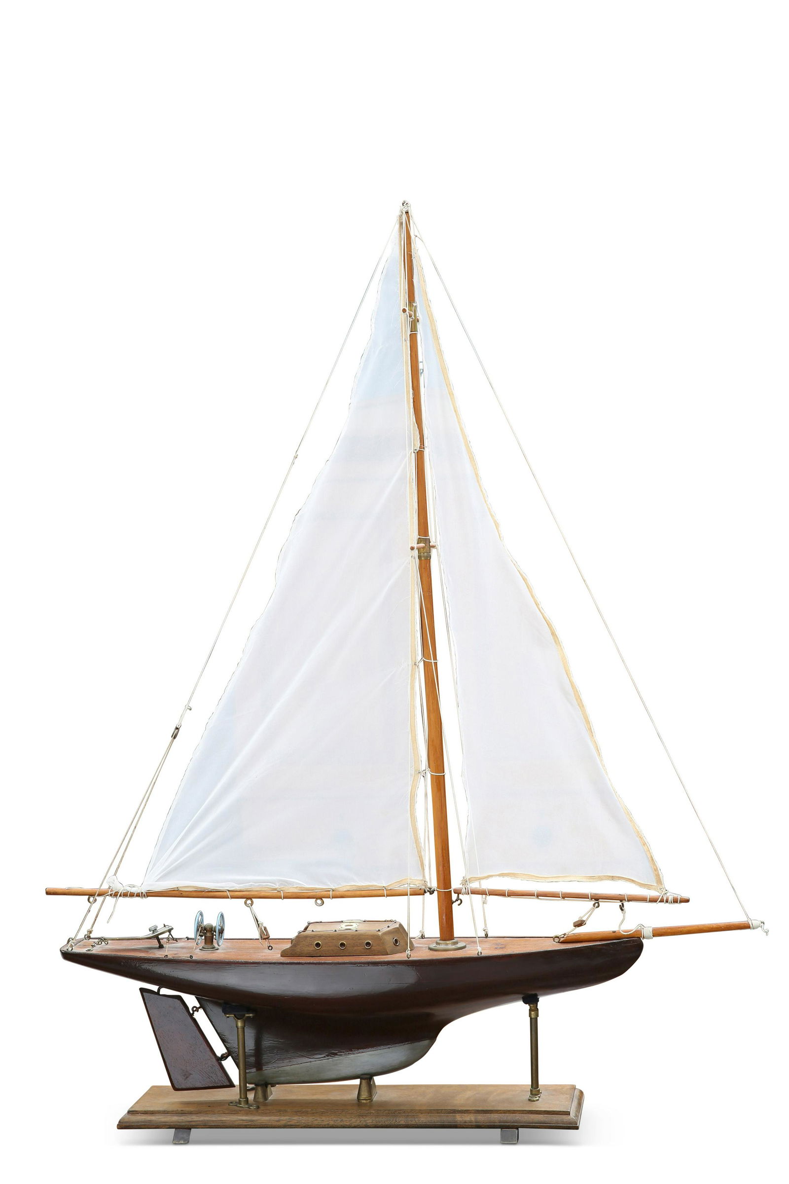 A 1930S WOODEN POND YACHT: on a brass and wooden stand; together with A DIORAMA OF SAILOR'S KNOTS. (2) Yacht 121cm high overall