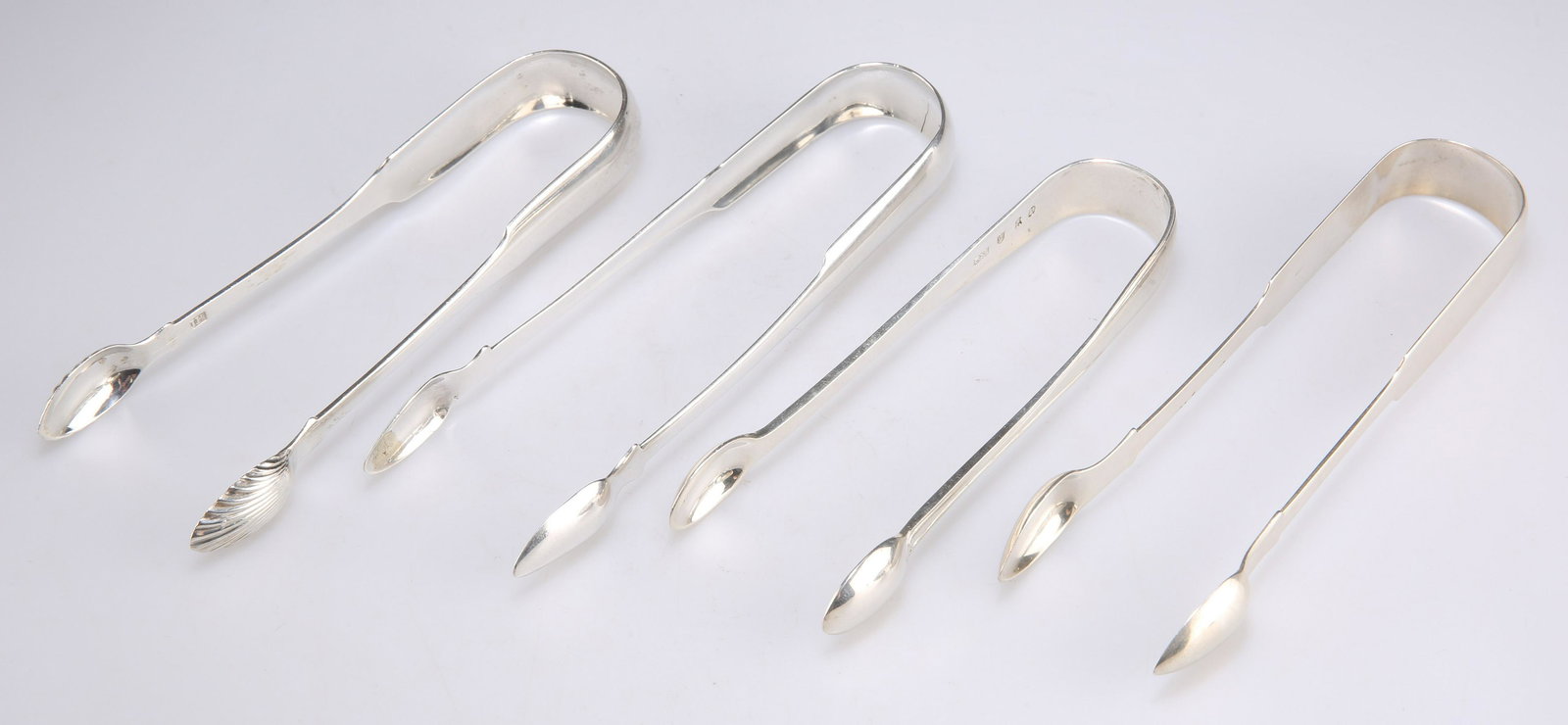 FOUR PAIRS OF SILVER SUGAR TONGS, GEORGE III AND LATER (1 of 2)