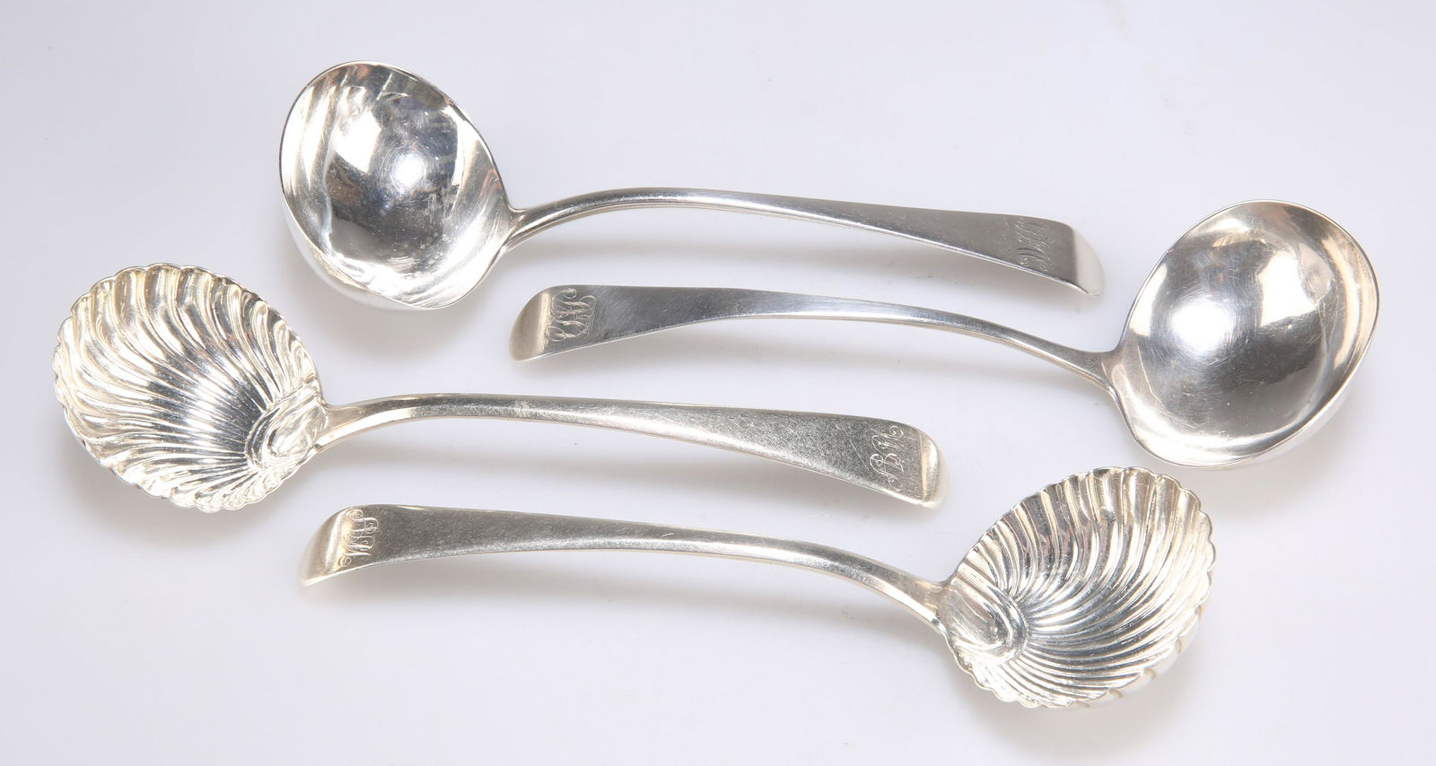 A PAIR OF GEORGE III SILVER SAUCE LADLES (1 of 2)