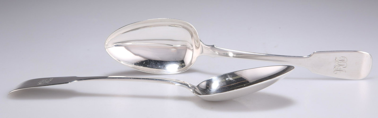 A PAIR OF EARLY VICTORIAN IRISH SILVER TABLE SPOONS (1 of 2)