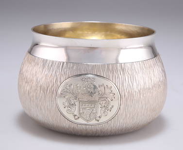 AN ELIZABETH II SILVER BOWL: AN ELIZABETH II SILVER BOWL by Gerald Benney, London 1976, the underside stamped GERALD BENNEY LONDON, circular with bark effect textured bellied sides below a polished rim. 7cm high, 11cm diameter, 8