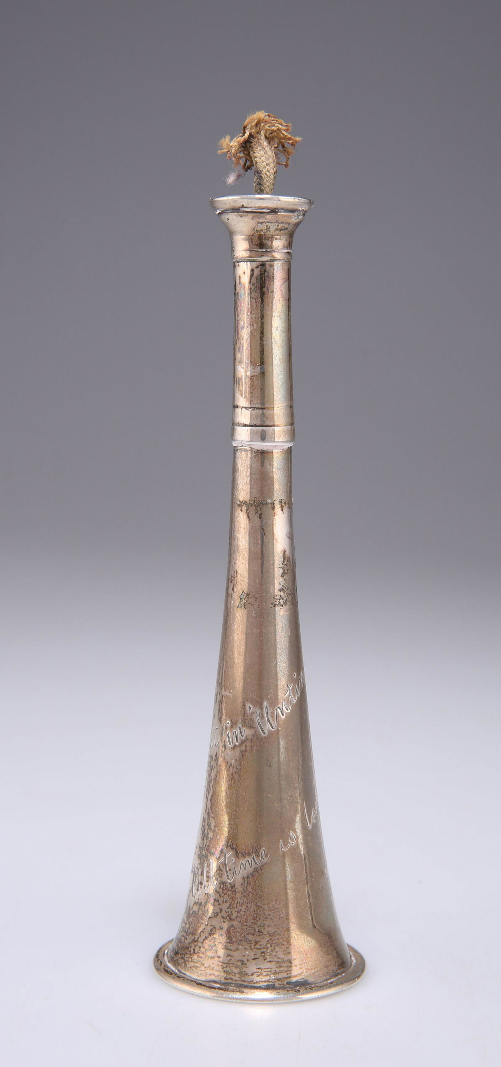 A VICTORIAN SILVER NOVELTY TABLE LIGHTER: A VICTORIAN SILVER NOVELTY TABLE LIGHTER by William Thomas Wright & William Frederick Wright, London 1893, in the form of a hunting horn, with screw-thread 'mouthpiece', engraved All time is lost,
