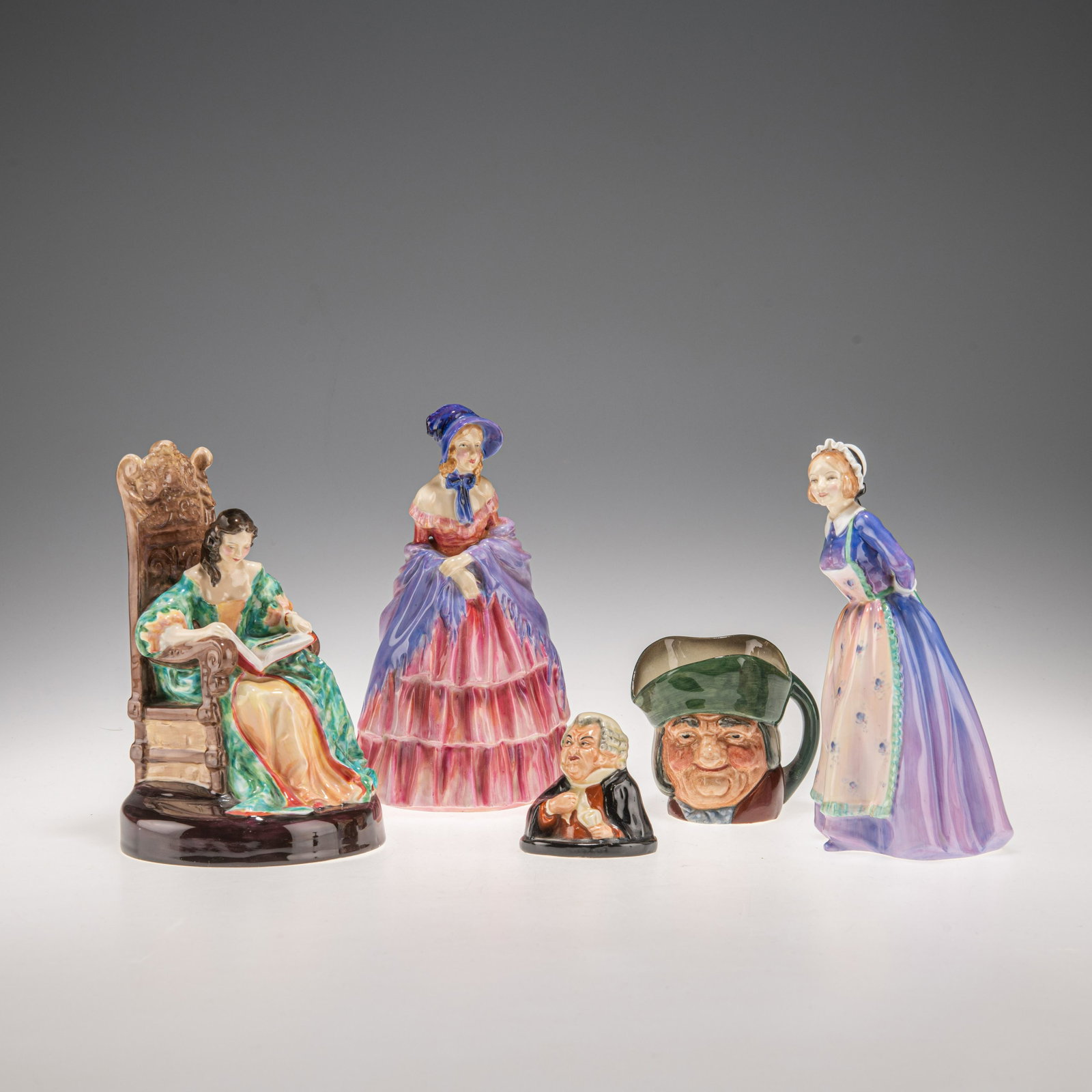 A GROUP OF ROYAL DOULTON FIGURES: A GROUP OF ROYAL DOULTON FIGURES comprising 'The Leisure Hour', HN2055; 'Victorian Lady', HN728; 'Susan', H2056; 'Buzfuz'; and a 'Toby Philpotts' miniature character jug. (5) 18cm high and smaller All