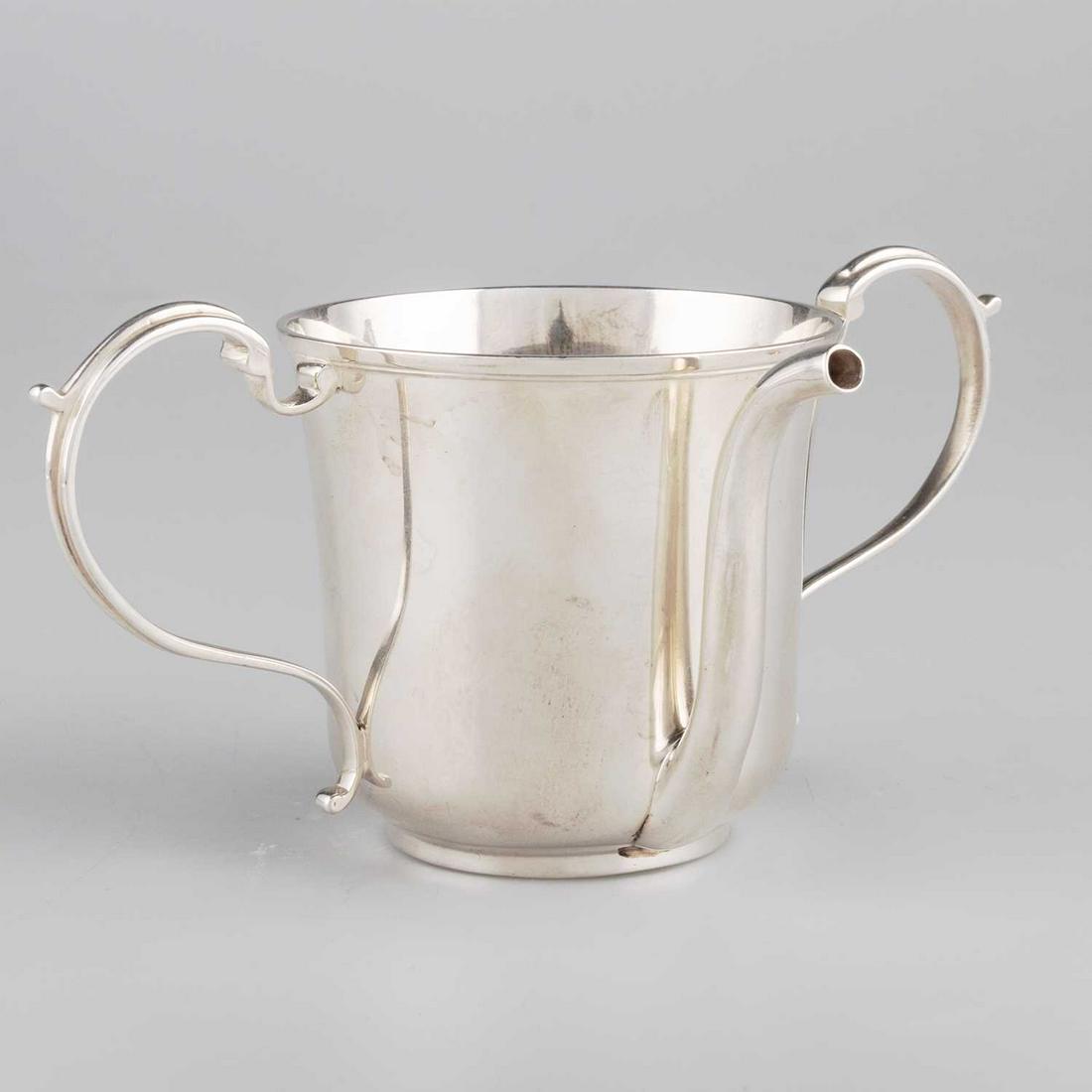 A GEORGE IV SILVER INVALID FEEDING BOAT: A GEORGE IV SILVER INVALID FEEDING BOAT by Thomas Johnson, London 1824, the cylindrical cup with twin S-scroll handles and tall spout. 8.5cm high, 5.5 troy ounces