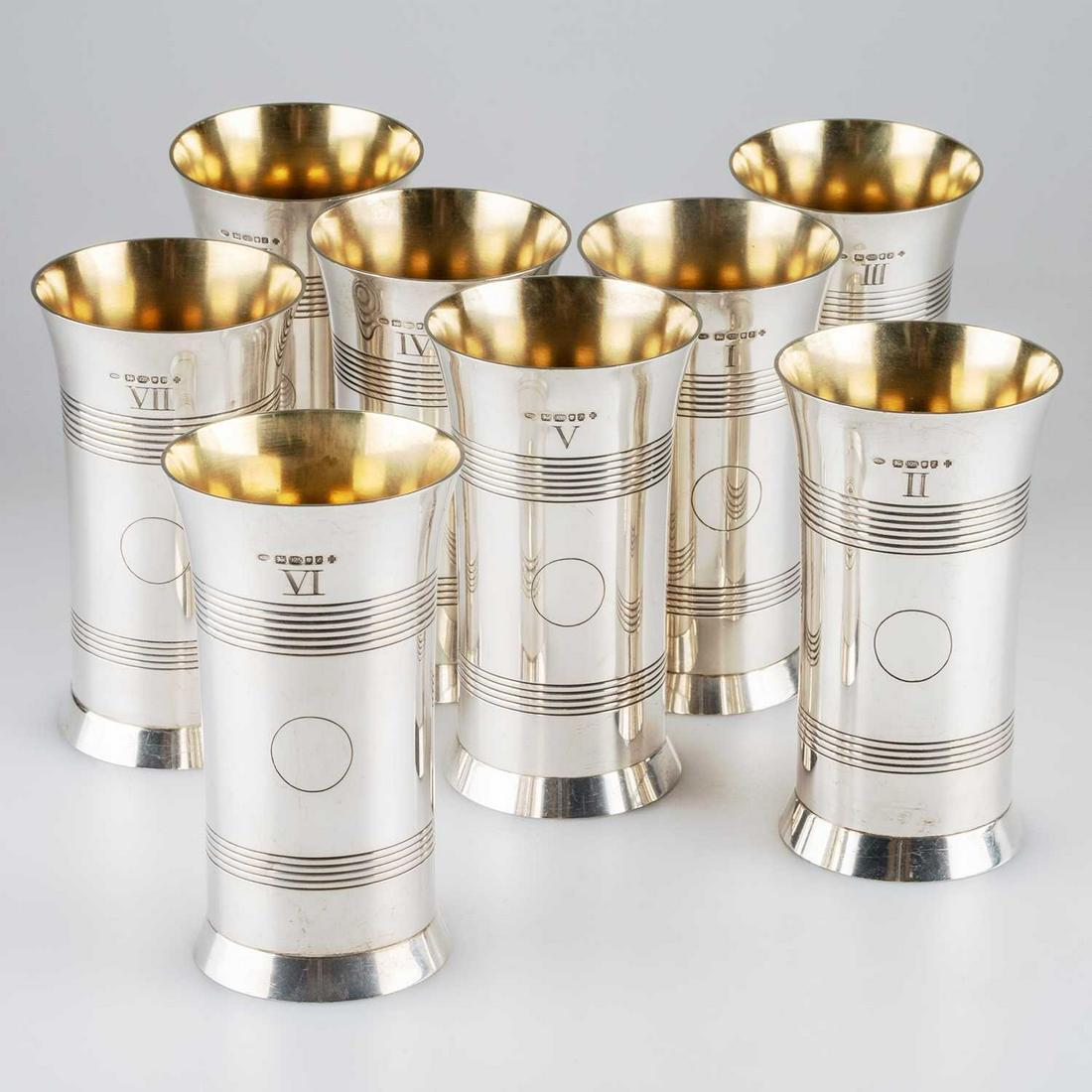 SHOOTING INTEREST: A SET OF EIGHT SILVER BEAKERS, IN THE FORM OF ARTILLERY SHELL CASES: SHOOTING INTEREST: A SET OF EIGHT SILVER BEAKERS, IN THE FORM OF ARTILLERY SHELL CASES by G J Dennis, London 1999, each engraved with a peg number in Roman numerals from I to VIII, with central vacant