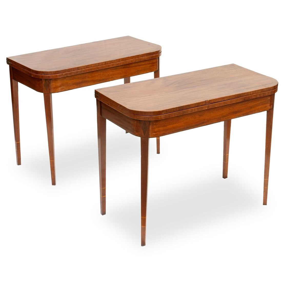 A PAIR OF GEORGE III ROSEWOOD BANDED AND STRUNG MAHOGANY FOLDOVER TEA TABLES: A PAIR OF GEORGE III ROSEWOOD BANDED AND STRUNG MAHOGANY FOLDOVER TEA TABLES each with rounded corners and gateleg action, raised on square-section tapering legs. (2) 73cm high, 91.5cm wide, 45cm deep