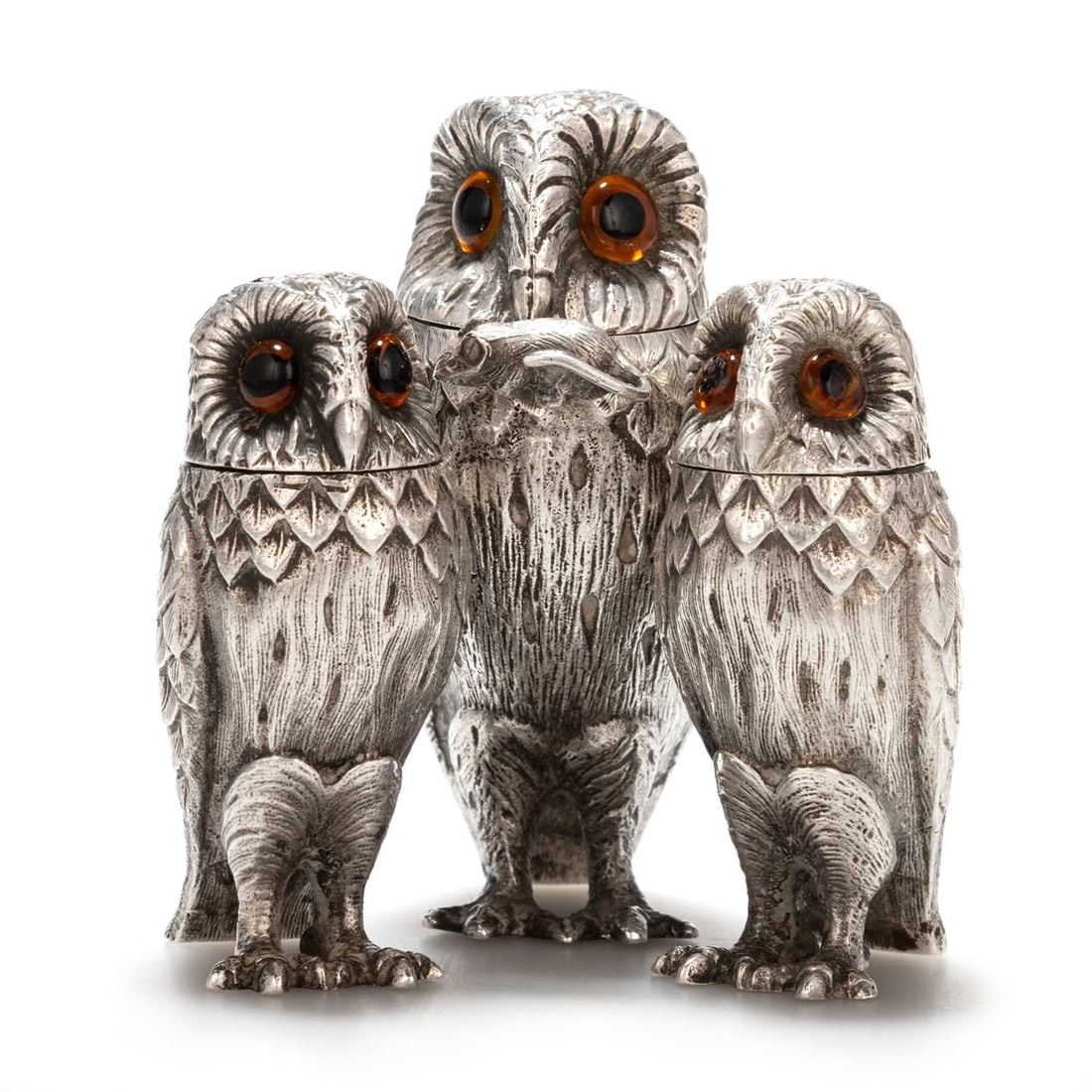 AN ELIZABETH II SILVER NOVELTY CONDIMENT SET: AN ELIZABETH II SILVER NOVELTY CONDIMENT SET by Richard Comyns, London 1977, comprising mustard, salt and pepperette, each cast in the form of an owl with glass eyes, the mustard with original mouse t