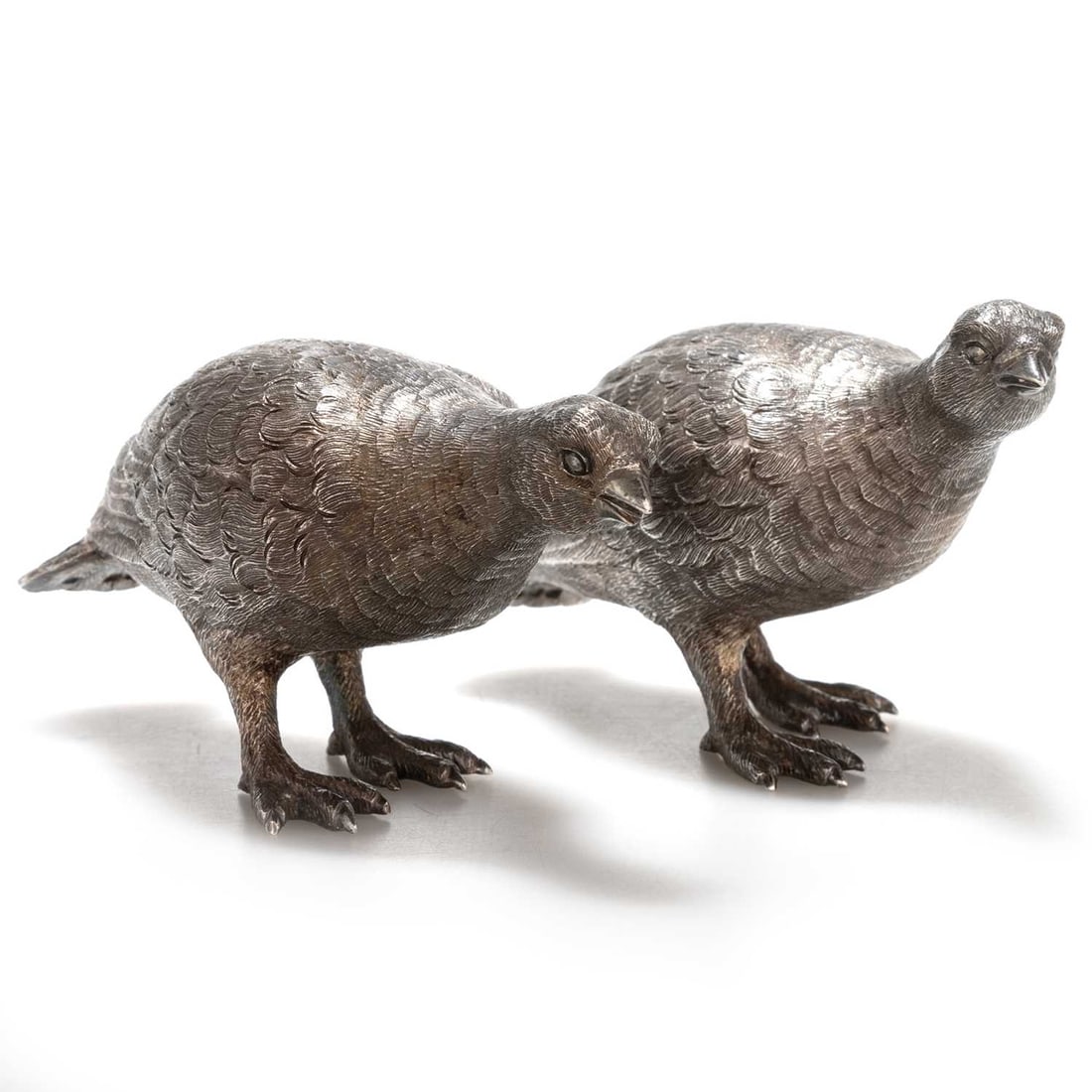 A PAIR OF ELIZABETH II SILVER MODELS OF GROUSE: A PAIR OF ELIZABETH II SILVER MODELS OF GROUSE by Richard Comyns, London 1966, each realistically cast. (2) 12.5cm long, 14.2 troy ounces gross The marks are clear. In generally very good condition w