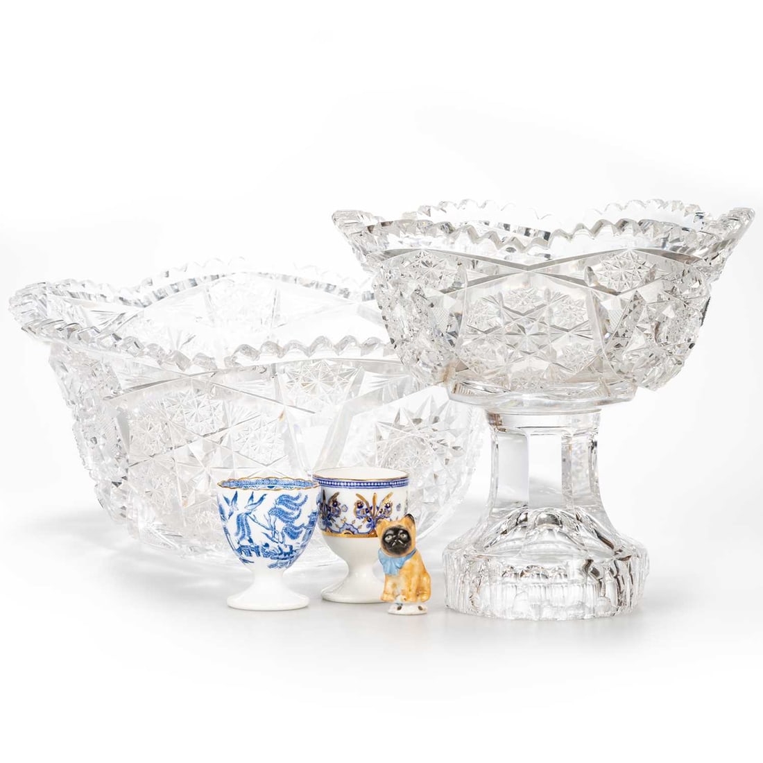 A MIXED GROUP OF CERAMICS AND GLASS: A MIXED GROUP OF CERAMICS AND GLASS including a Copeland blue and white egg cup; an English porcelain blue and white, gilt egg cup, probably Staffordshire; a drip catcher in the form of a French Bull