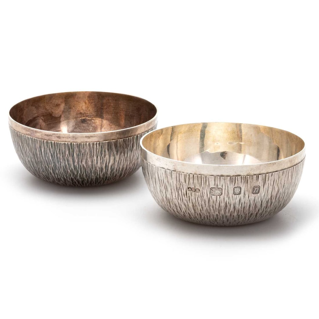 A PAIR OF ELIZABETH II SILVER BOWLS: A PAIR OF ELIZABETH II SILVER BOWLS by Gerald Benney, London 1968, of textured design. (2) 9cm diameter, 7.8 troy ounces gross good condition, wear commensurate with age, clear marks