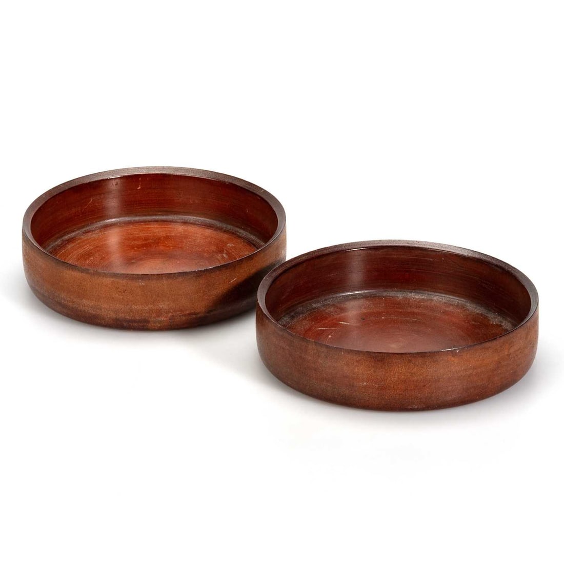 A PAIR OF GEORGIAN PRESSED LEATHER COASTERS: A PAIR OF GEORGIAN PRESSED LEATHER COASTERS of simple circular form. (2) 15cm diameter