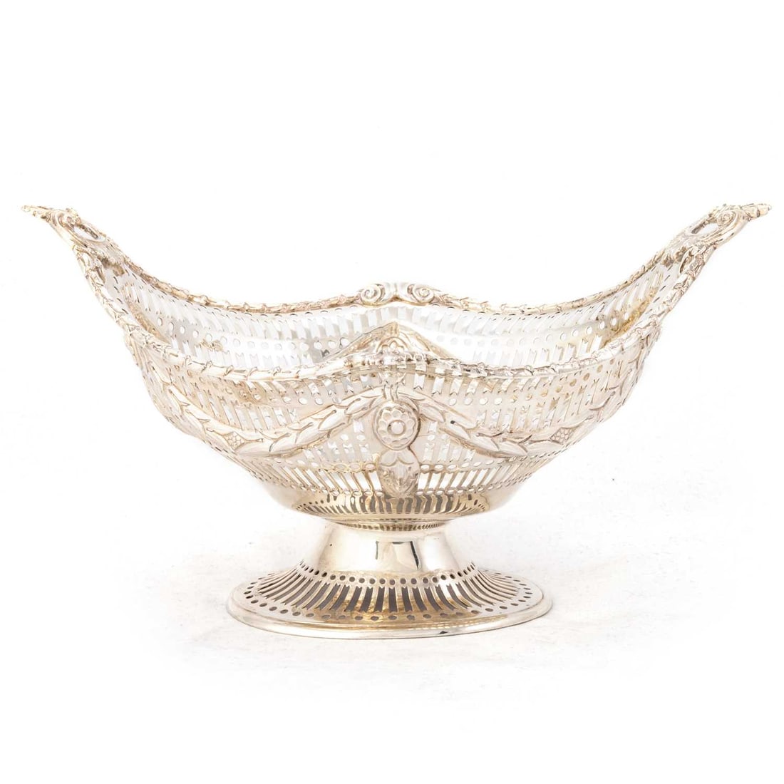 A VICTORIAN SILVER TABLE BASKET: A VICTORIAN SILVER TABLE BASKET by Charles Stuart Harris, London 1895, of shaped oval form, the pierced sides chased with swags. 24.5cm wide, 12.3 troy ounces