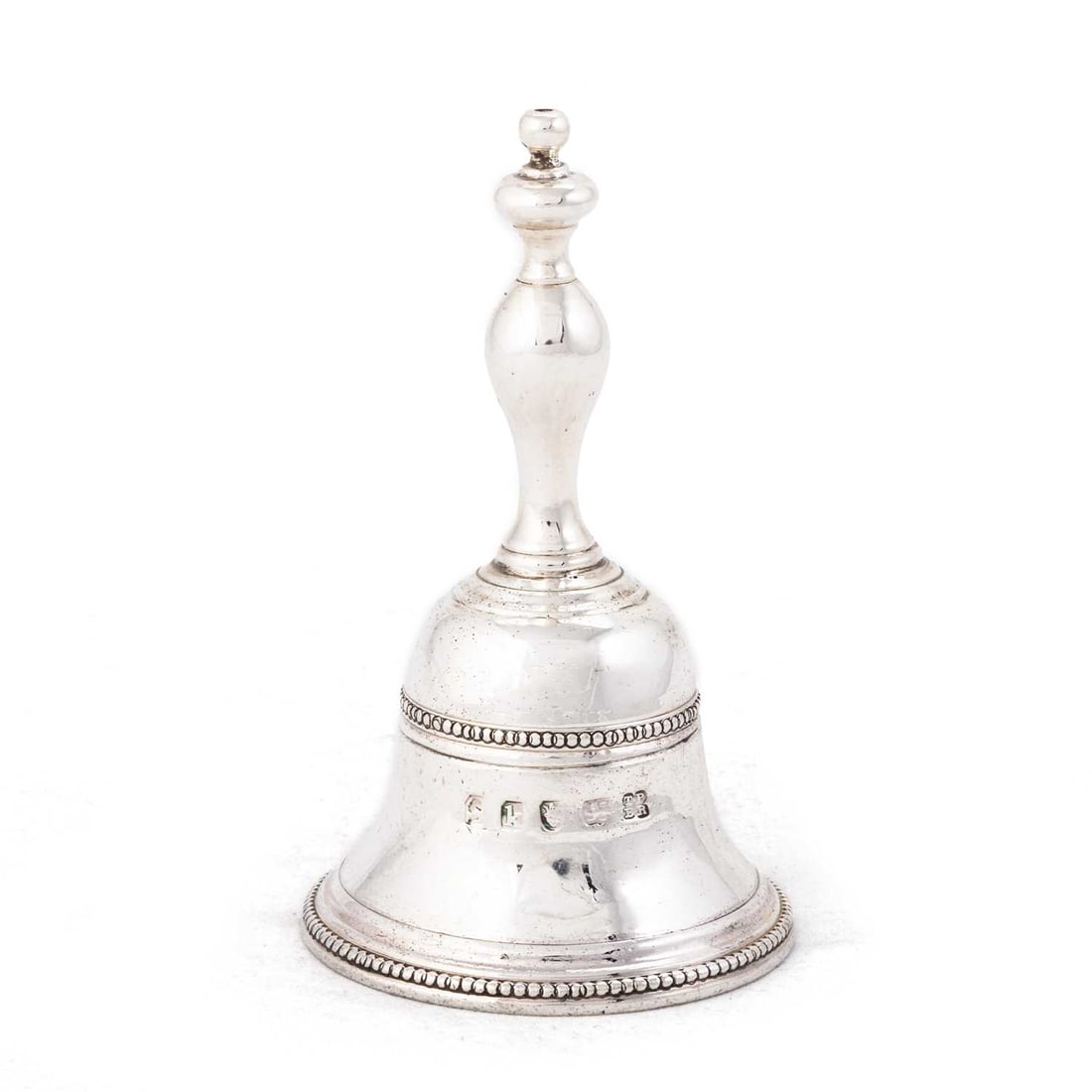 A GEORGE III CAST SILVER TABLE BELL (1 of 2)