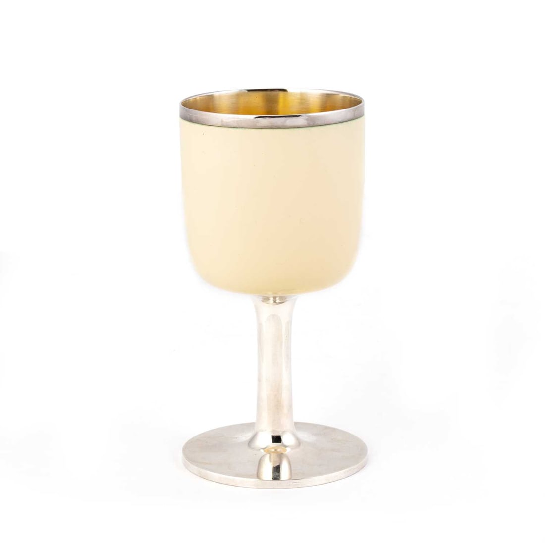 GERALD BENNEY: AN ELIZABETH II SILVER AND ENAMEL GOBLET: GERALD BENNEY: AN ELIZABETH II SILVER AND ENAMEL GOBLET by Gerald Benney, London 1971, the bowl decorated with cream enamel, the interior gilded, raised on a plain stem issuing from a circular foot.