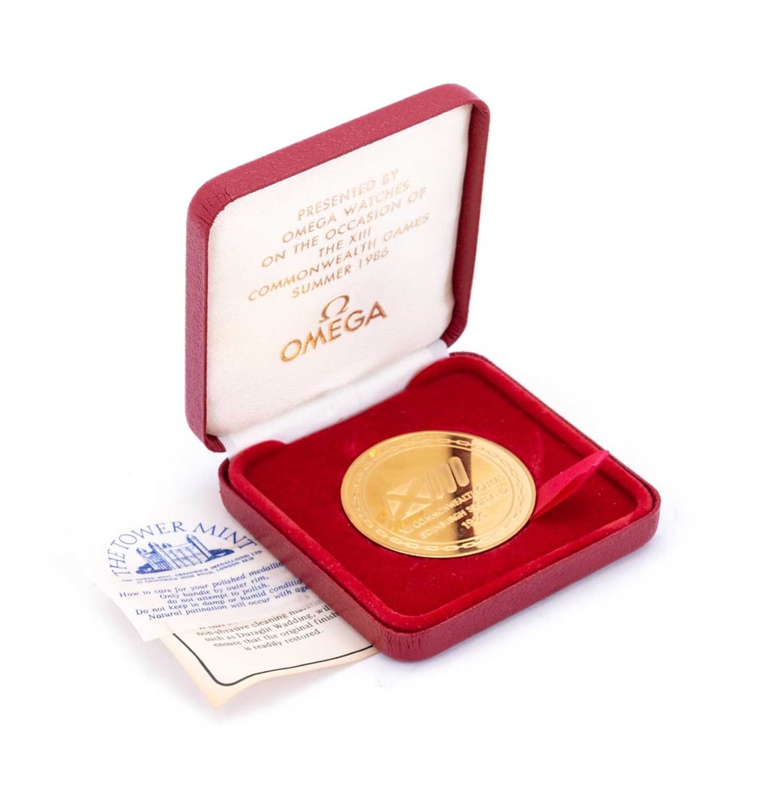 A The Tower Mint Commemorative Gold Plated Omega Medallion Auction