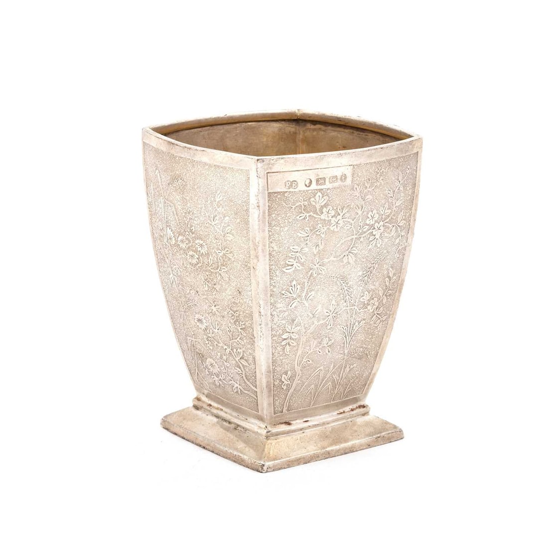 A VICTORIAN SILVER VASE: A VICTORIAN SILVER VASE by Elkington & Co (Frederick Elkington), London 1861, square form, decorated to three sides with panels of scrolling foliage, the remaining side plain, raised on a spreadin