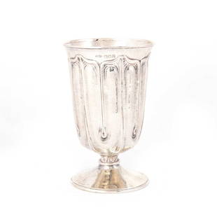 AN ARTS AND CRAFTS SILVER GOBLET: AN ARTS AND CRAFTS SILVER GOBLET by Ramsden & Carr (Omar Ramsden & Alwyn Carr), London 1907, of cylindrical form with an everted rim, the body chased with stylised foliate panels, planished, r