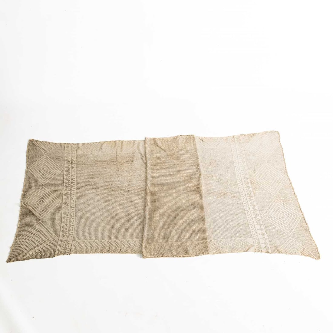 A 1920S EGYPTIAN HAMMERED SILVER AND CREAM LACE SHAWL: A 1920S EGYPTIAN HAMMERED SILVER AND CREAM LACE SHAWL with a geometric design. 95cm by 234cm