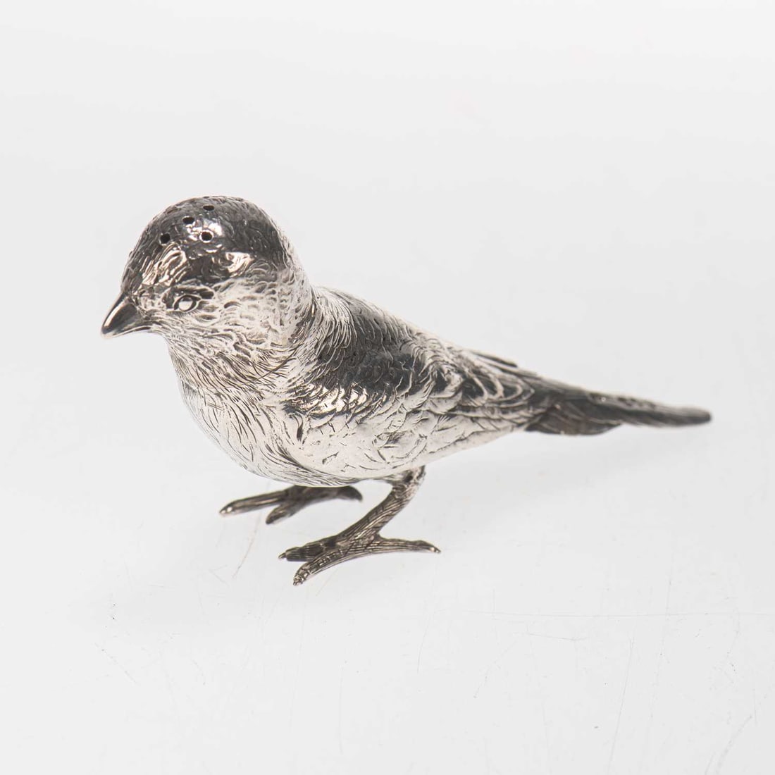 A VICTORIAN SILVER NOVELTY PEPPER POT: A VICTORIAN SILVER NOVELTY PEPPER POT by Frederick Elkington, London 1895, realistically modelled as a small bird. 12cm long, 2.7 troy ounces