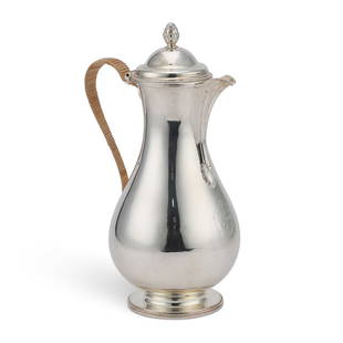 A GEORGE III SILVER COFFEE JUG: A GEORGE III SILVER COFFEE JUG by Andrew Fogelberg & Stephen Gilbert, London 1782, of slender baluster form with a crested domed cover, bead borders and a bud finial, the plain scroll handle with