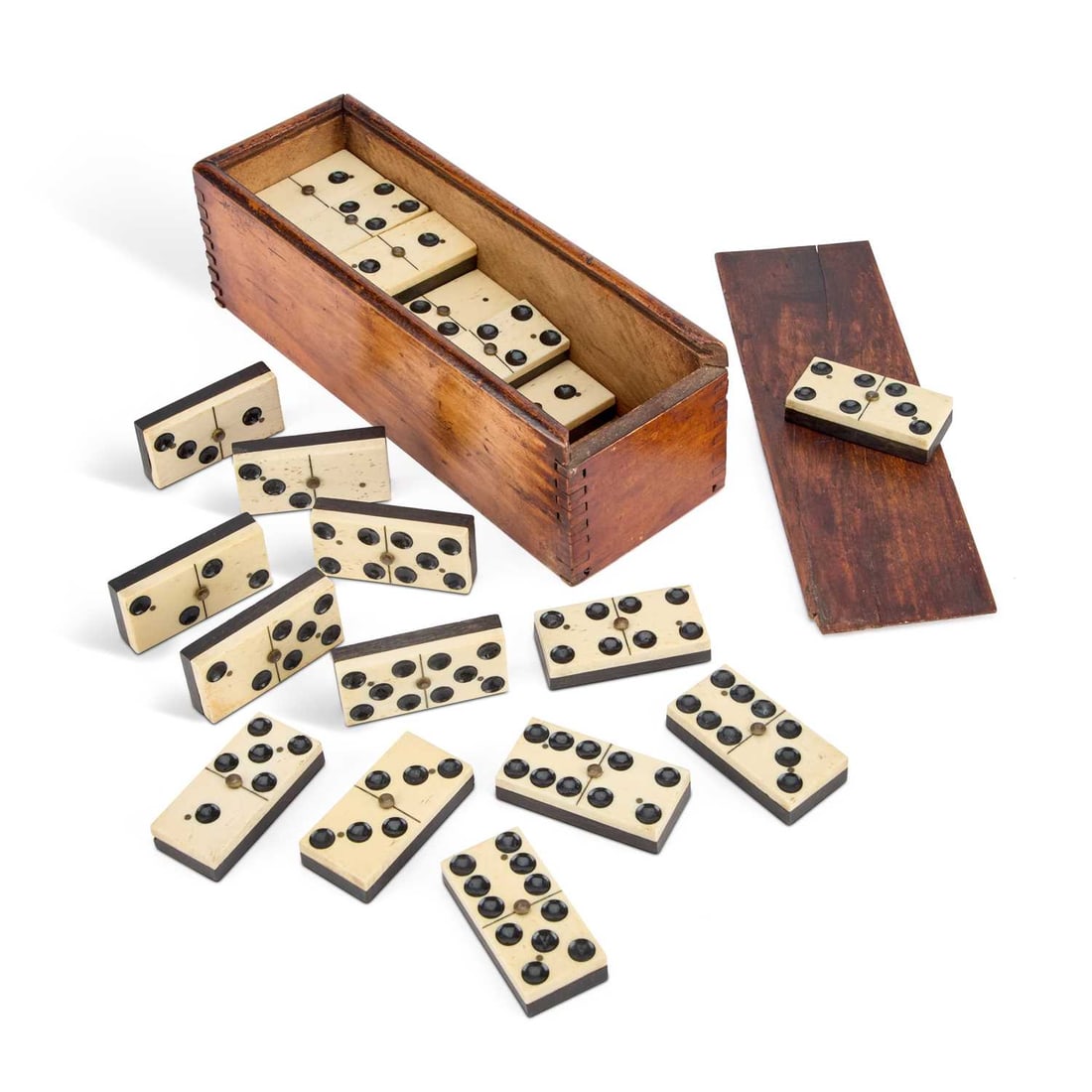 A BOXED SET OF LATE 19TH CENTURY EBONY AND BONE DOMINOES: A BOXED SET OF LATE 19TH CENTURY EBONY AND BONE DOMINOES each dominoe secured by brass studs. 5.2cm longQty: 27