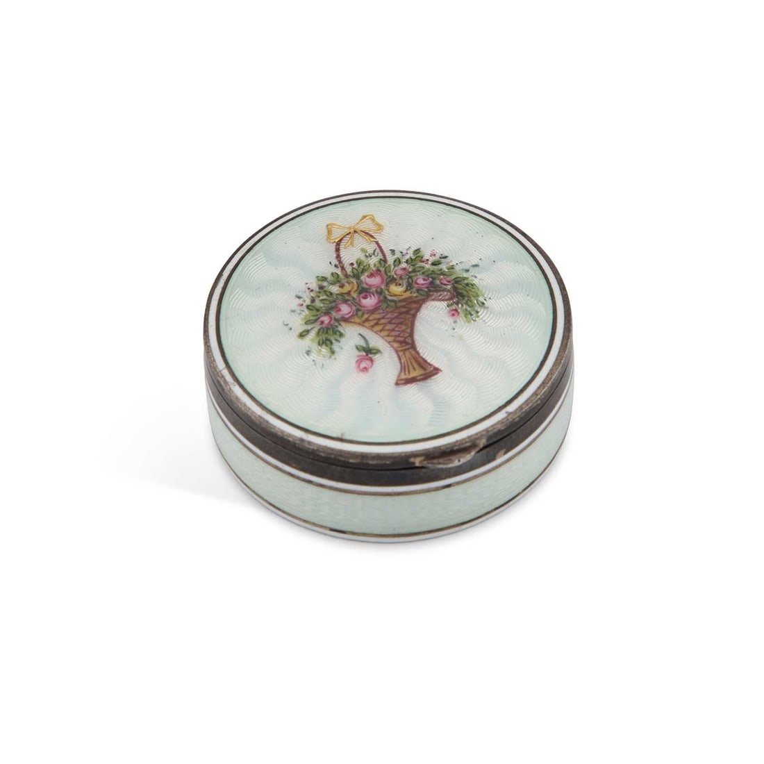 A CONTINENTAL SILVER AND ENAMEL PILL BOX: A CONTINENTAL SILVER AND ENAMEL PILL BOX 935 grade, early 20th Century, circular, covered in translucent light blue guilloché enamel, the hinged cover decorated with a basket of flowers, gilded inter