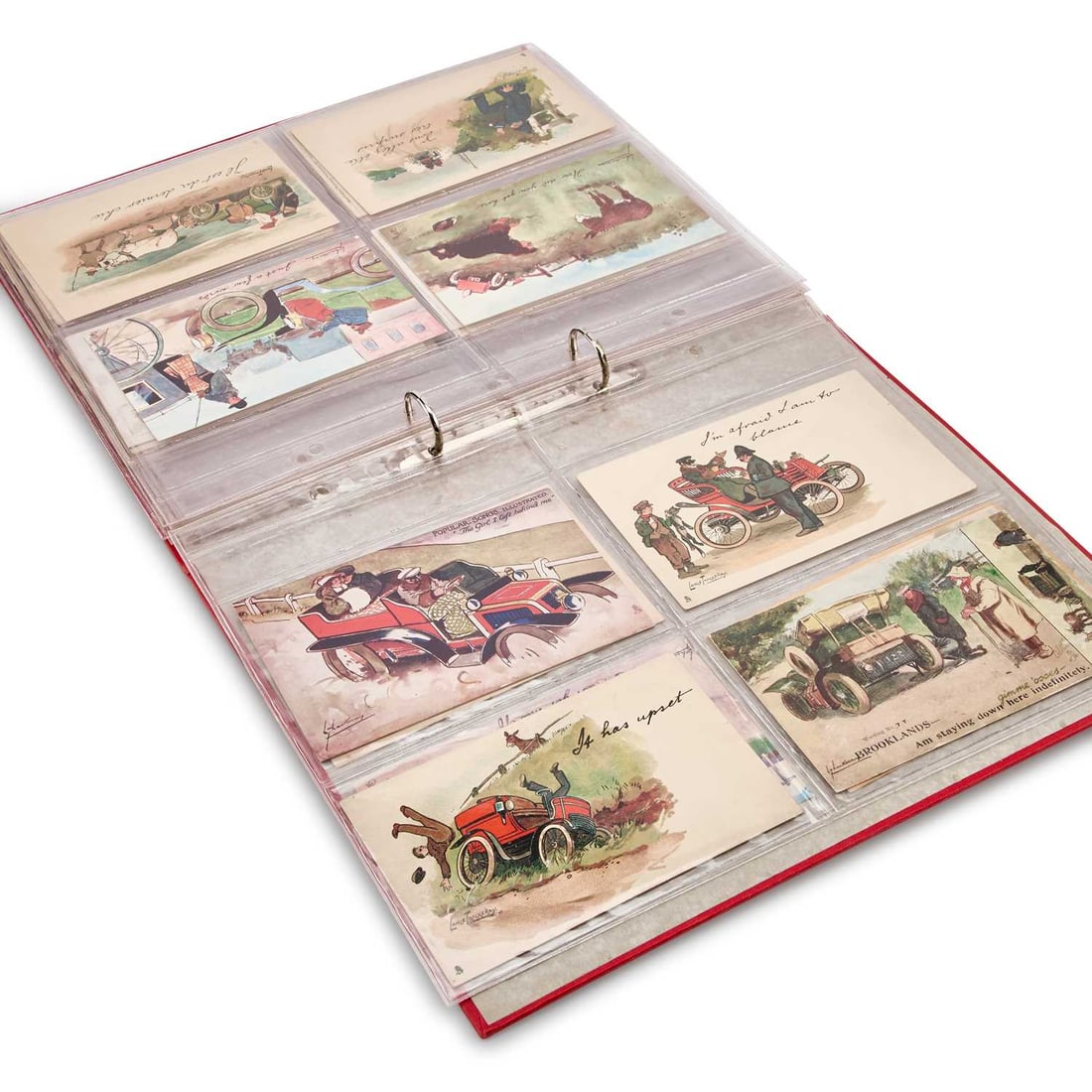 A COLLECTION OF 40 POSTALLY UNUSED AUTOMOBILIA POSTCARDS: A COLLECTION OF 40 POSTALLY UNUSED AUTOMOBILIA POSTCARDS by Lance Thackeray, the majority of the designs by Raphael Tuck & Sons. (1 album) Forty postcards in the album.