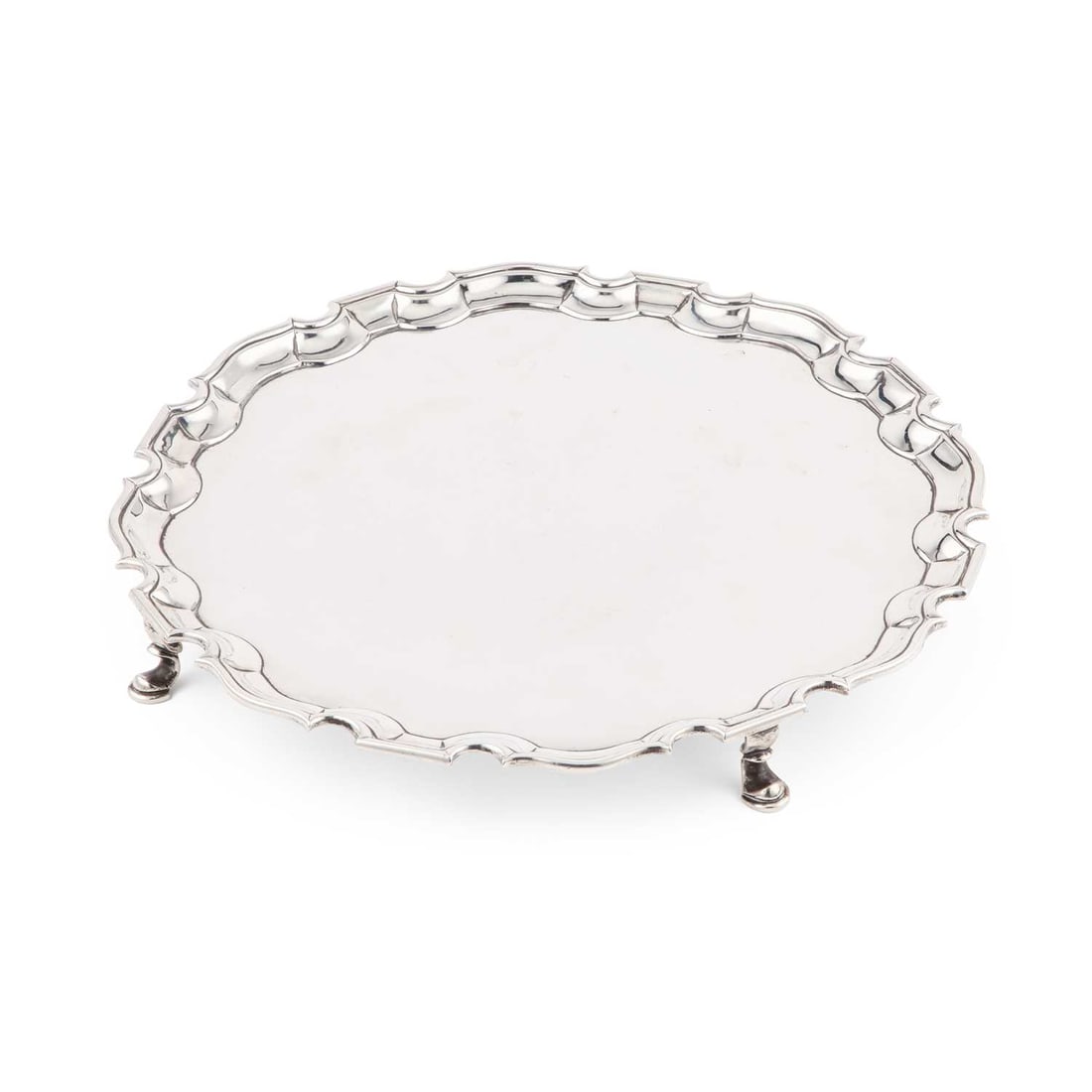 A GEORGE II SILVER SALVER: A GEORGE II SILVER SALVER by Robert Abercromby, London 1737, of shaped circular form with a moulded border, raised on four hoof feet. 31.5cm diameter, 27.6 troy ounces The marks are clear. Engraved
