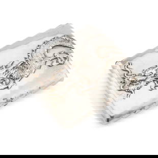 A CHINESE SILVER CIGARETTE CASE: A CHINESE SILVER CIGARETTE CASE retailed by Sing Fat, Canton, early 20th Century, oblong, shaped for the pocket, applied with a dragon wrapped around the front and back, signed to the interior. 8.2cm