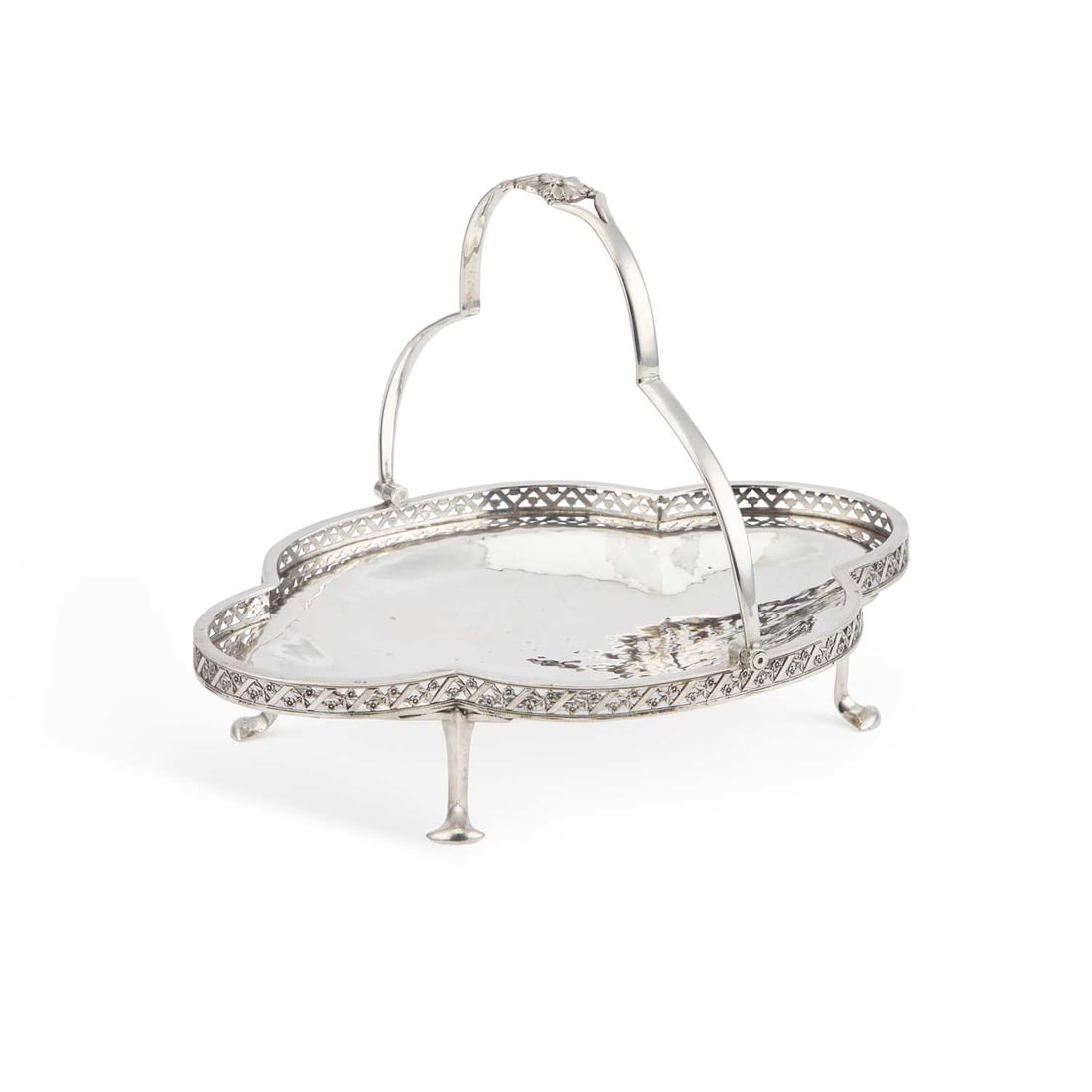 A.E. JONES: AN ARTS AND CRAFTS SILVER BASKET: A.E. JONES: AN ARTS AND CRAFTS SILVER BASKET by Albert Edward Jones, Birmingham 1921, of quatrefoil shape with galleried sides and pierced lattice, chased flowers between very fine bands of beading, t