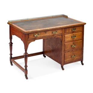 A LATE 19TH CENTURY OAK DESK BY SHAPLAND & PETTER: A LATE 19TH CENTURY OAK DESK BY SHAPLAND & PETTER the moulded rectangular top with a gilt-brass gallery and gilt-tooled leather-inset writing surface above five drawers, moving on castors. 71cm high,