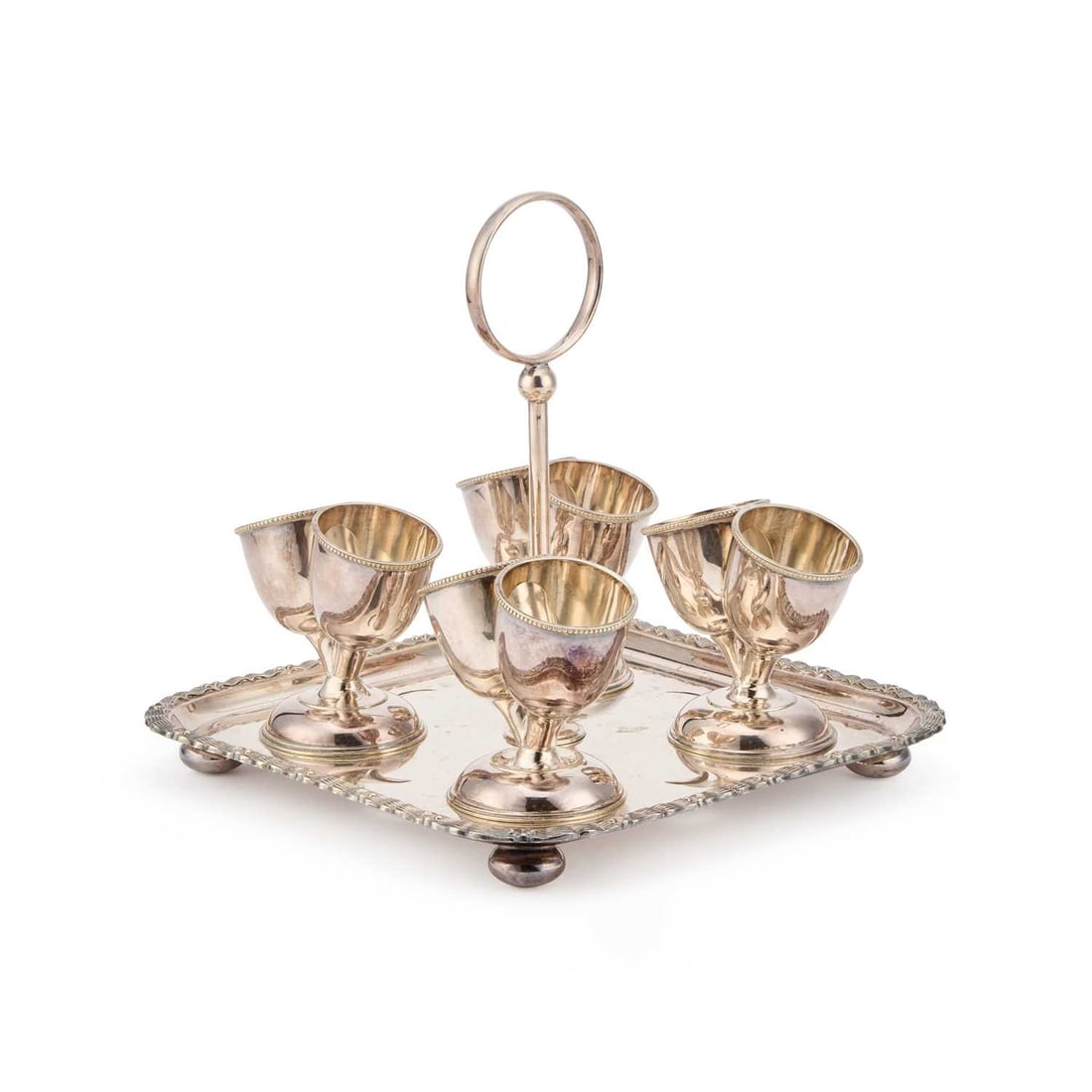 AN UNUSUAL VICTORIAN SILVER-PLATED EGG CRUET: AN UNUSUAL VICTORIAN SILVER-PLATED EGG CRUET with four double-egg cups. 23cm square