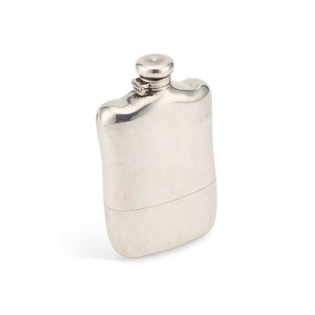 TIFFANY & CO: AN AMERICAN STERLING SILVER HIP FLASK: TIFFANY & CO: AN AMERICAN STERLING SILVER HIP FLASK Charles L. Tiffany period (1891-1902), shaped for the pocket, with a detachable cup to the base. 15cm high, 8.5 troy ounces