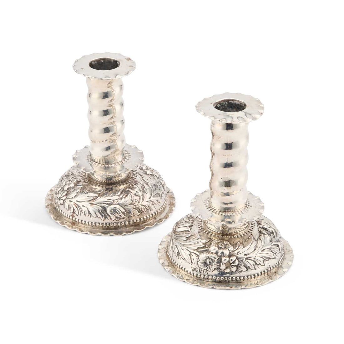 A PAIR OF VICTORIAN SILVER CANDLESTICKS: A PAIR OF VICTORIAN SILVER CANDLESTICKS one marked for George Fox, London 1880 and 1885. (2) 12cm high
