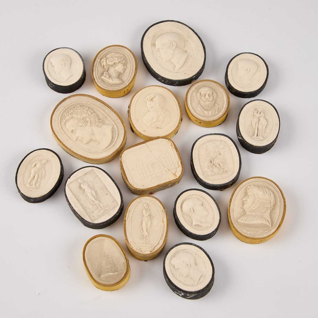 A COLLECTION OF SEVENTEEN PLASTER INTAGLIOS: A COLLECTION OF SEVENTEEN PLASTER INTAGLIOS (17) Longest 5.5cm