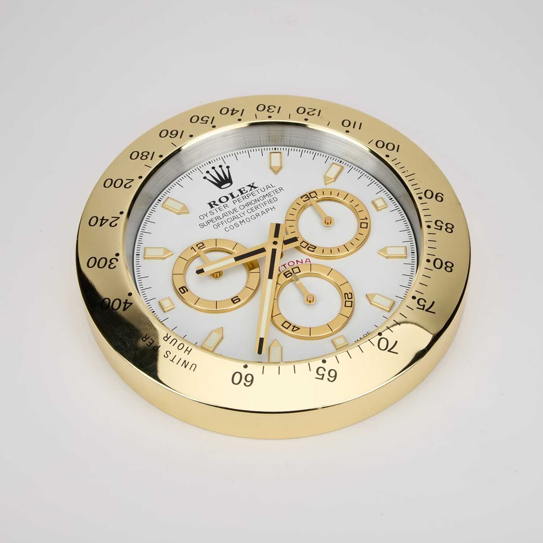 AN ADVERTISING WALL CLOCK, SIGNED ROLEX OYSTER PERPETUAL DAYTONA: AN ADVERTISING WALL CLOCK, SIGNED ROLEX OYSTER PERPETUAL DAYTONA quartz movement. 34cm diameter