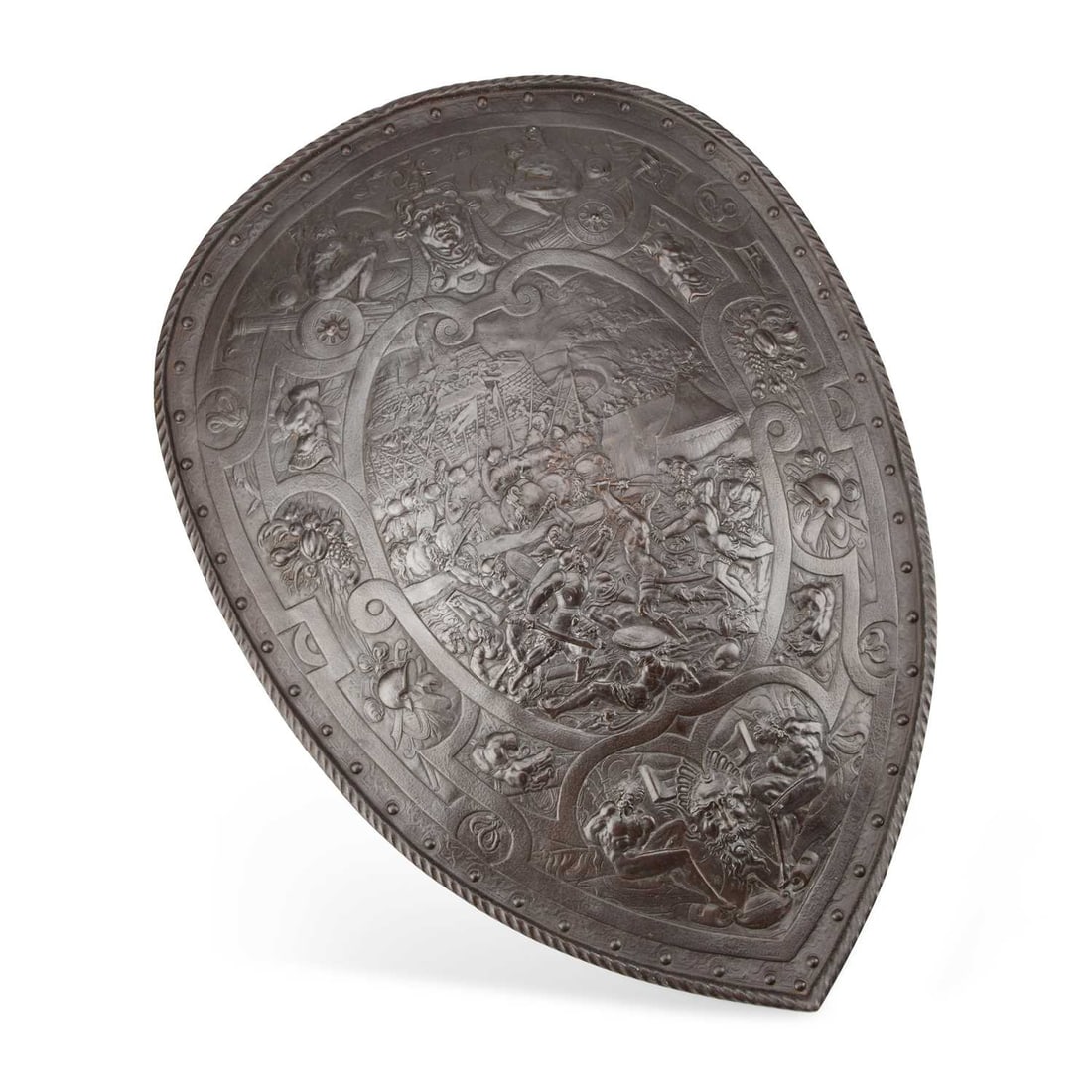 HUSQVARNA, AN IRON SHIELD IN THE RENAISSANCE STYLE: HUSQVARNA, AN IRON SHIELD IN THE RENAISSANCE STYLE cast with the maker's mark to the reverse. 61cm high