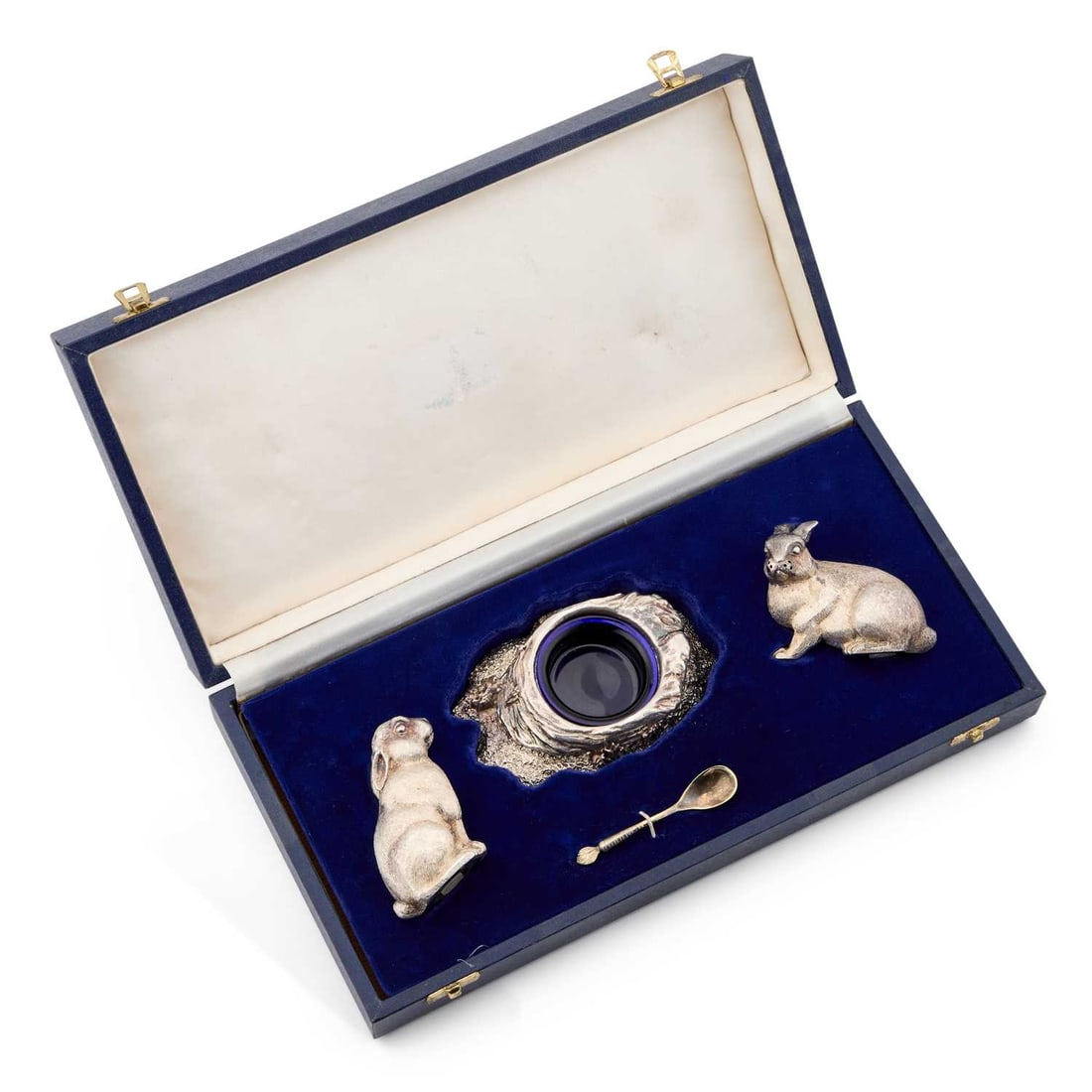 AN ELIZABETH II SILVER NOVELTY CONDIMENT SET: AN ELIZABETH II SILVER NOVELTY CONDIMENT SET by Richard Comyns, London 1990, the salt and pepper shaker each formed as a rabbit, one sitting upright and the other crouching, the mustard pot formed as