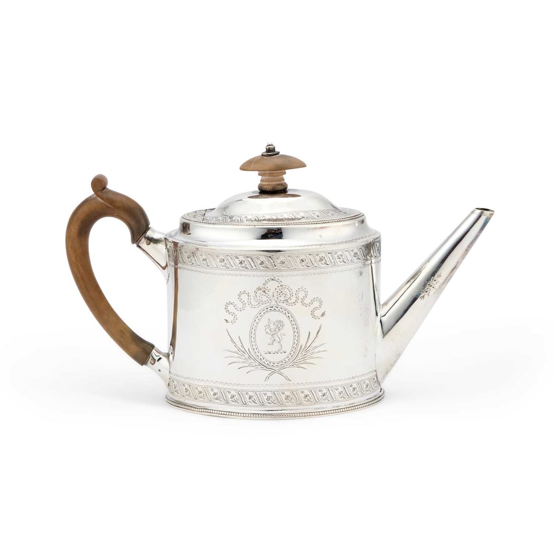 A RARE GEORGE III SILVER TEAPOT: A RARE GEORGE III SILVER TEAPOT by Peter & Jonathan Bateman, London 1790, oval, with bright-cut engraving. 14cm high, 12 troy ounces The PB/IB maker's Peter & Jonathan Bateman mark is highly